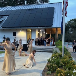 Dancers performing in front of crowd